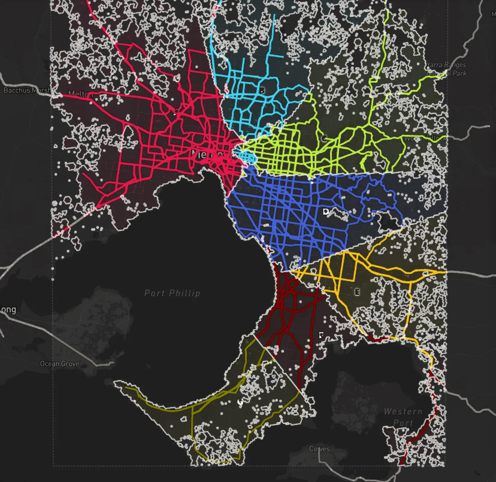 Greater Melbourne in seven colors, one per starting hex, every hex in the color of the starting hex it can be driven to soonest, with the roads drawn bright in the same colors and Port Phillip bay in the middle