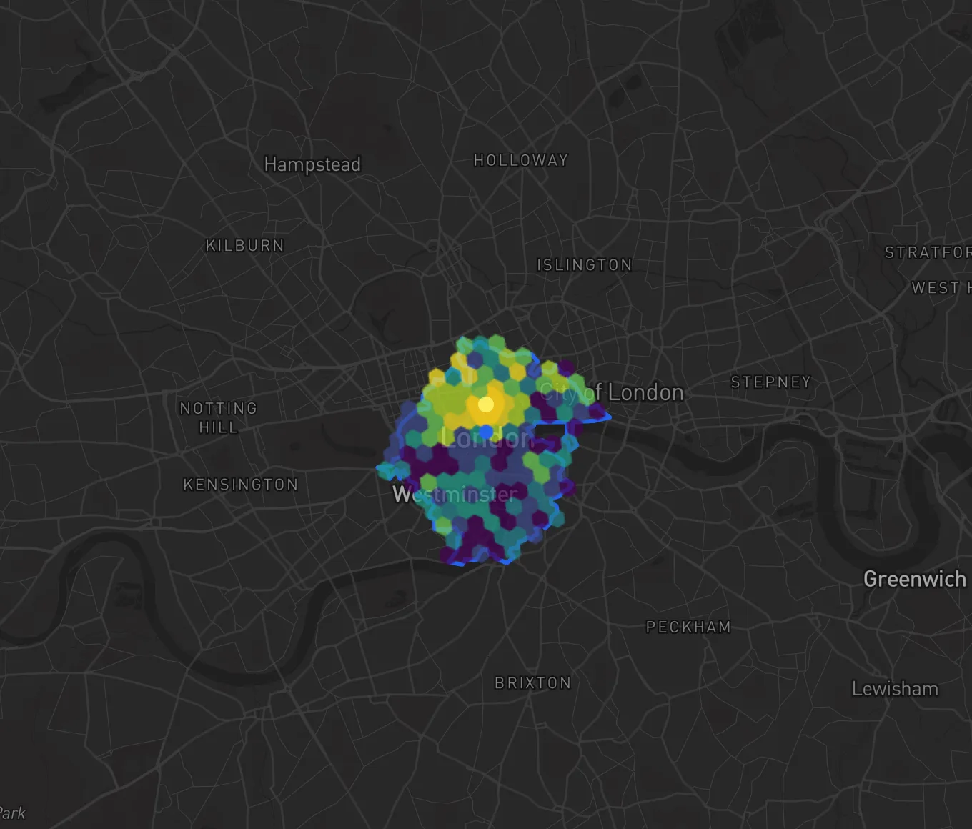 Central London with a 10-minute drive from Trafalgar Square outlined in blue, reaching from Bloomsbury in the north to the Thames in the south and from Hyde Park to the City of London; the hexes inside are colored from purple to yellow, brightest around Soho