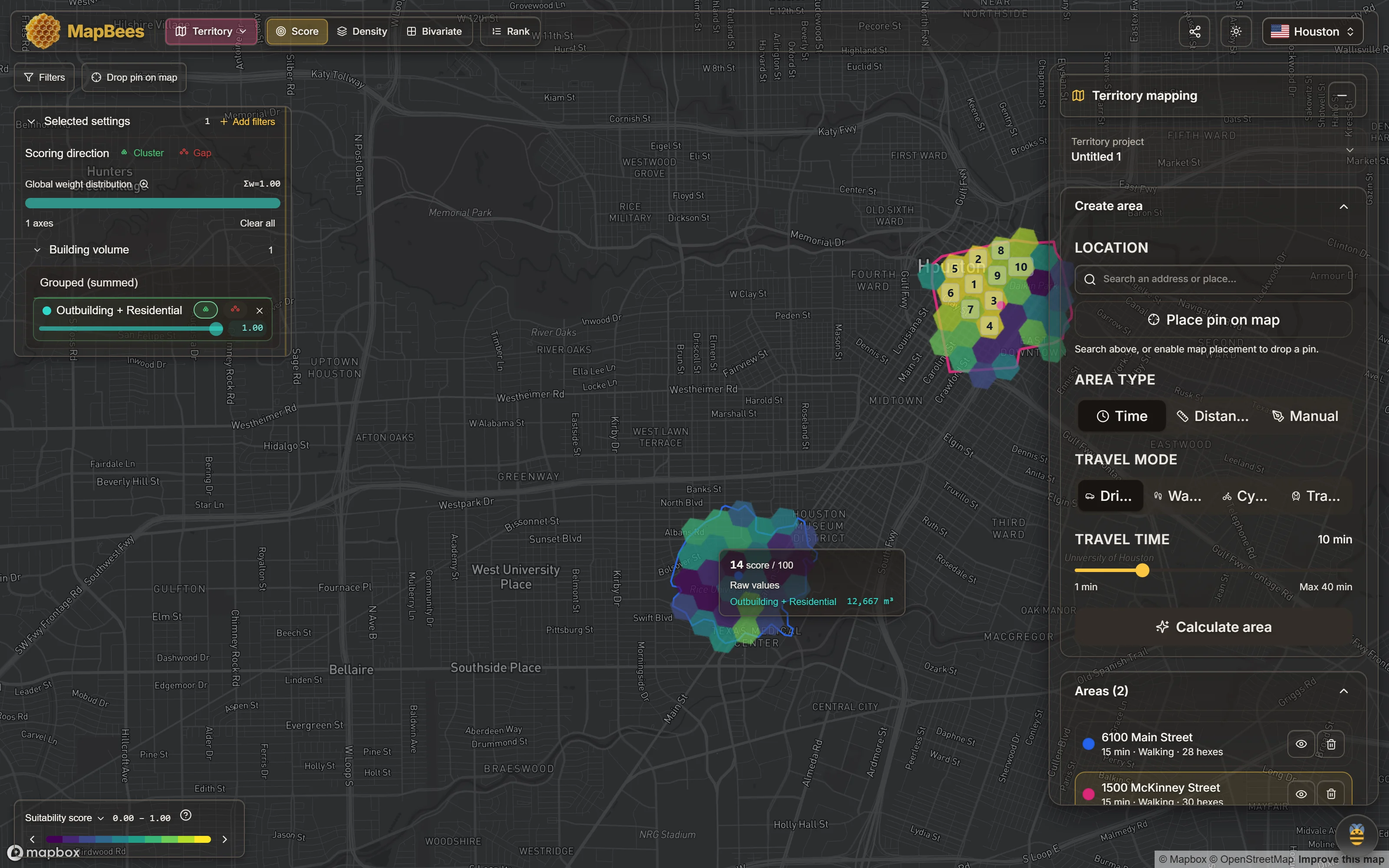 Central Houston with two irregular walking catchments drawn as clusters of coloured tiles, one around 6100 Main Street near the Texas Medical Center and one around 1500 McKinney Street downtown